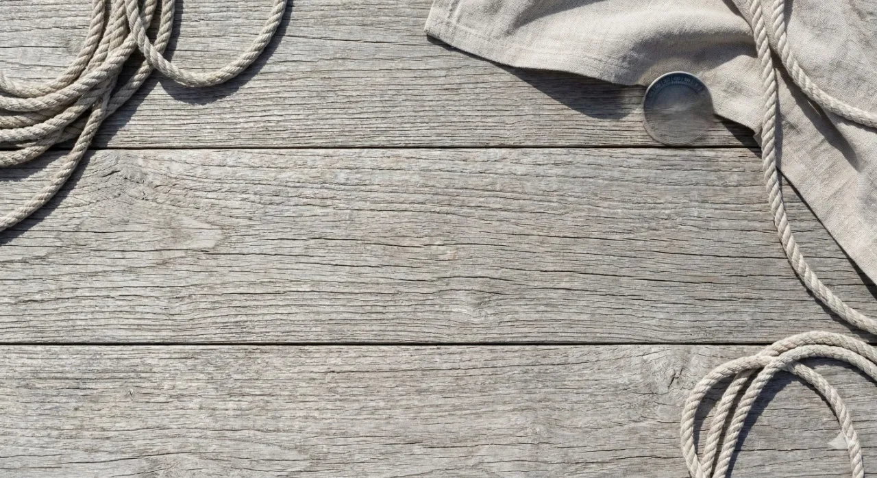 Fully weathered teak wood with elegant uniform silvery-grey patina